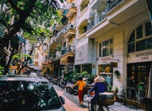 People Walking in Front of Buildings